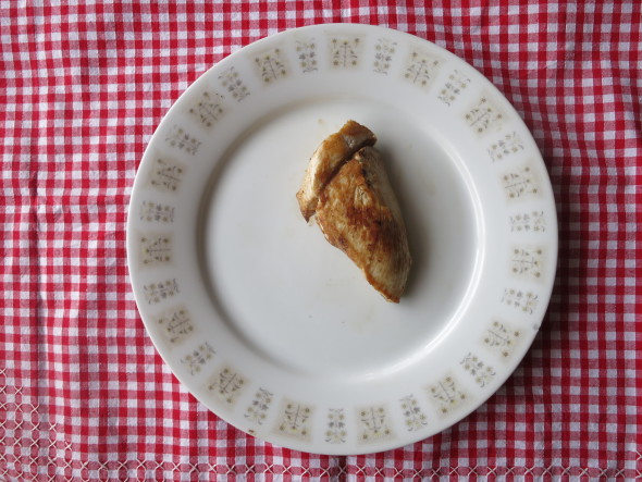 cooked chicken on gingham tablecloth